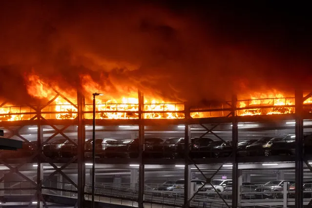A fire has started at Luton Airport's Terminal 2 car park in Luton, UK on October 10, 2023. Emergency services are in attendance and the area has been evacuated. Access to the airport is now restricted. (Photo by Marcin Nowak/London News Pictures)