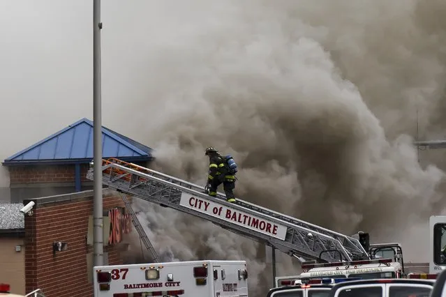 Firefigthers respond to a fire at a CVS pharmacy on Pennsylvania Avenue in Baltimore April 27, 2015. (Photo by Sait Serkan Gurbuz/Reuters)