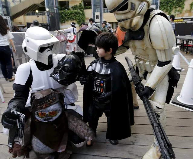 Cosplayers dressed up as Star Wars characters Scout Trooper (L), Storm Trooper (R) and Darth Vader take part in a Star Wars Day fan event in Tokyo May 4, 2015. (Photo by Toru Hanai/Reuters)