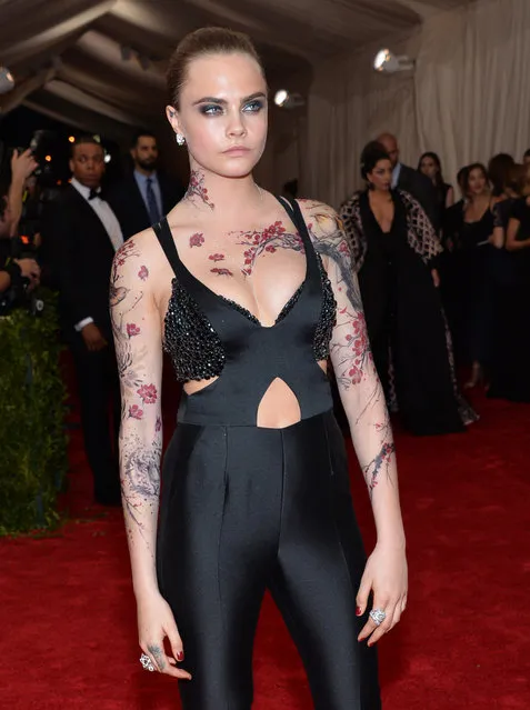 Cara Delevingne arrives at The Metropolitan Museum of Art's Costume Institute benefit gala celebrating “China: Through the Looking Glass” on Monday, May 4, 2015, in New York. (Photo by Evan Agostini/Invision/AP Photo)