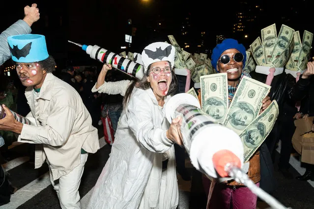 People attend the 48th annual Village Halloween parade along 6th Avenue in Manhattan on October 31, 2021. Attendance was high since New Yorkers were keen to meet one another and celebrate after Covid restrictions were eased. (Photo by Lev Radin/Pacific Press/Rex Features/Shutterstock)
