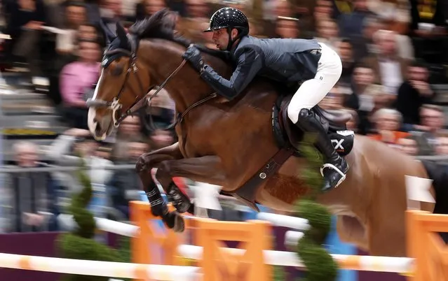 France's Julien Anquetin riding Blood Diamond du Pont competes to win the “Grand Prix Hermes CSI 5” International Jumping Competition at the Grand Palais Ephemere in Paris, on March 17, 2024. (Photo by Franck Fife/AFP Photo)