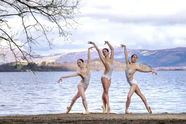 Scottish Ballet dancers (left to right) Urara Takata, Danila Marzilli and Seira Winning dance on the banks of Loch Lomond on Tuesday, March 26, 2024 ahead of the Swan Lake tour, which opens in Glasgow next week then tours to Aberdeen, Inverness and Edinburgh. (Photo by Jane Barlow/PA Images via Getty Images)