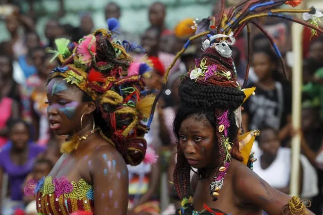 Women with painted faces take part in a parade during the Popo (Mask) Carnival of Bonoua, in the east of Abidjan, April 9, 2016. (Photo by Luc Gnago/Reuters)