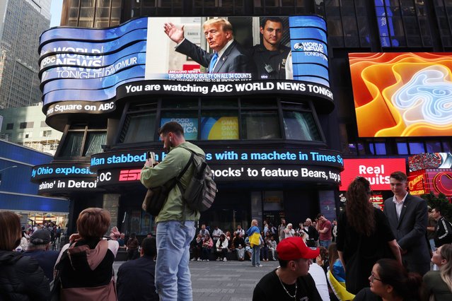 Screens display news of former U.S. President Donald Trump's conviction in his hush money trial in Times Square on May 30, 2024 in New York City. A jury has found former U.S. President Donald Trump guilty on 34 felony counts of falsifying business records in the first of his criminal cases to go to trial. Sentencing is set for July 11th.  (Photo by Michael M. Santiago/Getty Images)