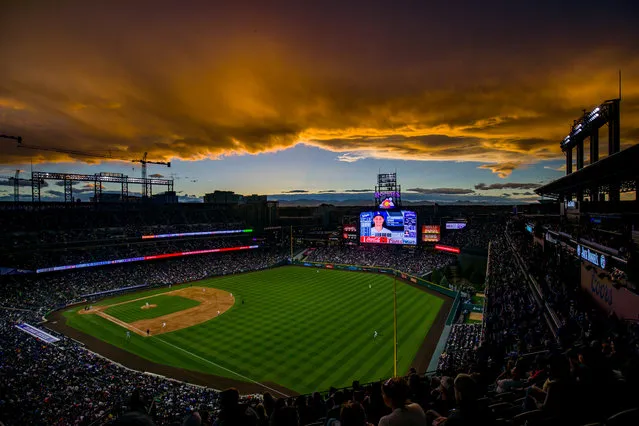 The sun sets over the stadium as the Colorado Rockies take on the Los Angeles Dodgers at Coors Field on April 7, 2019 in Denver, Colorado. (Photo by Justin Edmonds/Getty Images)