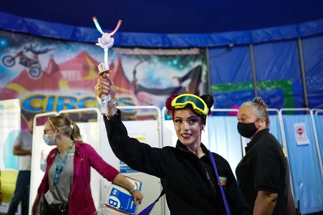 A member of staff sells toys next to a new “Pop Up” vaccination centre opened in the Big Top of Circus Extreme in Shibden Park on July 31, 2021 in Halifax, England. The pop-up clinic will be situated just outside the UKs largest circus Big Top so even people who do not have tickets to the show will still be able to get their vaccine. All adults in England have been able to book a first dose since June 18, but the latest figures show that nearly a third of young adults (aged 18 to 29) in the country have still not had one. (Photo by Ian Forsyth/Getty Images)