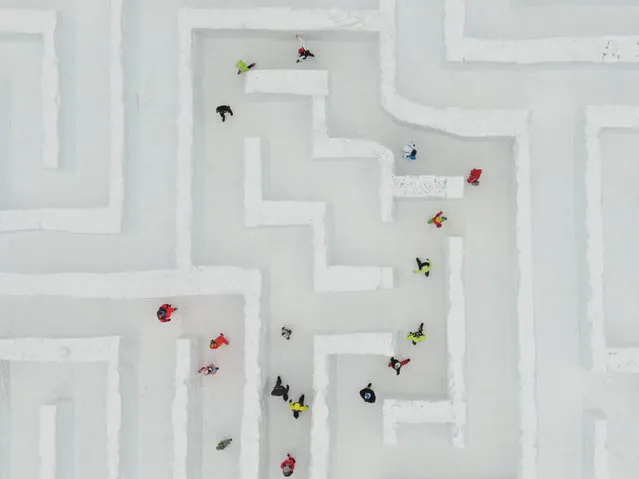 A drone view of people trying to find the way out in the biggest snow maze in the world in Zakopane, Poland, January 17, 2022. The snow maze idea was created for the first time in the winter season of 2015/2016 with an area of 2500 square metters and was already consider the biggest snow maze in the world. This season the organization increased the size to 3000 square metters and still keeps the title of the biggest snow maze in the world. Poland recently registered 100 thousand deaths by coronavirus and today marked an increased of 34% in covid-19 cases compared to last week. (Photo by Omar Marques/Anadolu Agency via Getty Images)