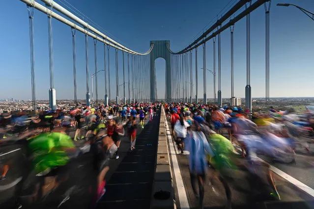 Runners cross the Verrazano Narrow Bridge during the 2017 TCS New York City Marathon in New York on November 3, 2019. (Photo by Johannes Eisele/AFP Photo)
