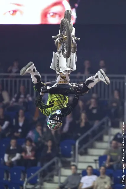 Brice Izzo races at the Night of the Jumps freestyle motocross acrobatics at O2 arena