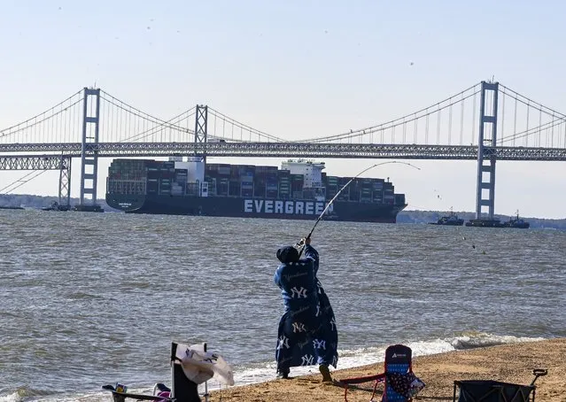 The container ship Ever Forward was finally freed Sunday morning just after 7 a.m. near Pasadena, Md and is towed under the Chesapeake Bay Bridge on April 17, 2022.  Crews unloaded 500 containers in an effort to lighten the load. The ship ran aground after departing Baltimore for Norfolk on March 13. Position data shows it missed a right turn in the deep shipping channel leading out of Baltimore and down the bay, becoming lodged on the bottom of the bay north of the Bay Bridge. (Photo by Jonathan Newton/The Washington Post)