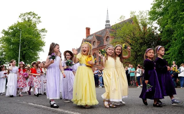 Children take part in the Royal May Day procession through the streets of Knutsford, Cheshire on Saturday, May 7, 2022. (Photo by Martin Rickett/PA Images via Getty Images)