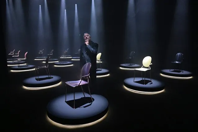 French designer Philippe Starck poses by models of “Miss Dior” Medallion chairs he designed for Dior are displayed as part of the “Dior by Starck” exhibition on June 6, 2022 on the eve of the opening of the Salone del Mobile furniture fair in Milan. (Photo by Miguel Medina/AFP Photo)