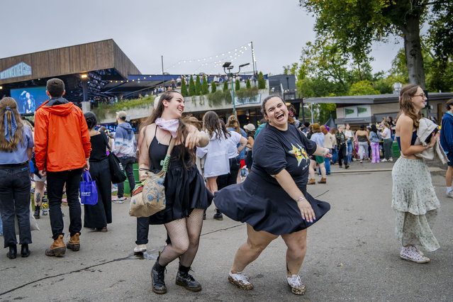 Brittany Evans, 27, and Hannah Cohen, 27, dance during a MUNA set at the All Things Go festival in Columbia, Maryland, on September 29, 2024. (Photo by Allison Robbert for The Washington Post)
