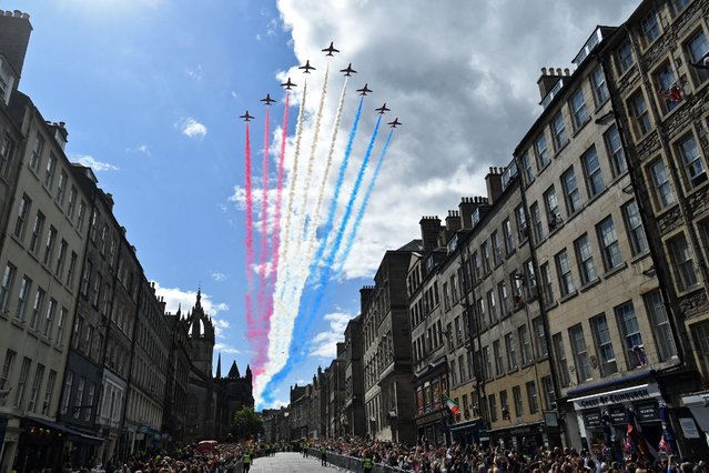 The British Royal Air Force's (RAF) aerobatic team, the “Red Arrows”, perform a fly-past over The Royal Mile in Edinburgh on July 5, 2023, following a National Service of Thanksgiving and Dedication. Scotland on Wednesday marked the Coronation of King Charles III and Queen Camilla during a National Service of Thanksgiving and Dedication where the The King was presented with the Honours of Scotland. (Photo by Mark Runnacles/Pool via AFP Photo)