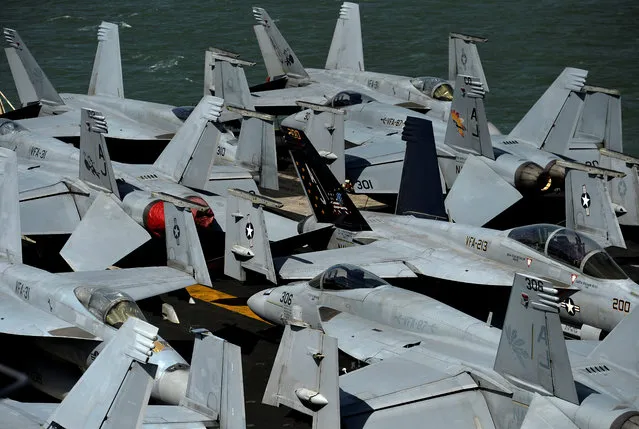 F/A-18 aircraft are seen on the flight deck of the USS George H.W. Bush aircraft carrier anchored off Stokes Bay in the Solent, Britain on July 27, 2017. (Photo by Hannah McKay/Reuters)