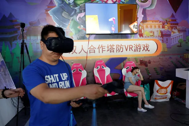 A man tries Virtual Reality (VR) games at the China Digital Entertainment Expo and Conference (ChinaJoy) in Shanghai, China July 27, 2017. (Photo by Aly Song/Reuters)