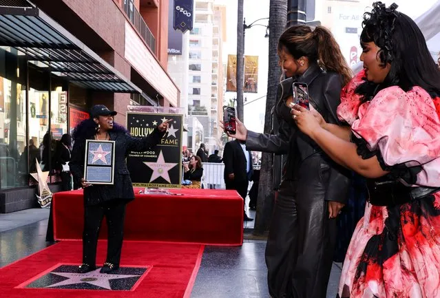 Singer Ciara and singer Lizzo record Hip Hop legend Missy Elliott as she poses at the unveiling ceremony of her star on the Hollywood Walk of Fame in Los Angeles, California, U.S., November 8, 2021. (Photo by Mike Blake/Reuters)