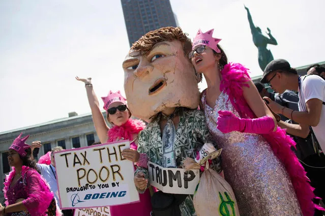 CodePink demonstrators protest at an anti-Donald Trump rally in Cleveland, Ohio, near the Quicken Loans Arena site of the Republican National Convention July 18, 2016. (Photo by Jim Watson/AFP Photo)