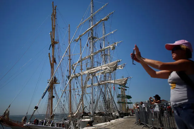 People look on during the Tall Ships Races 2016 parade, in Lisbon, Portugal July 25, 2016. (Photo by Pedro Nunes/Reuters)