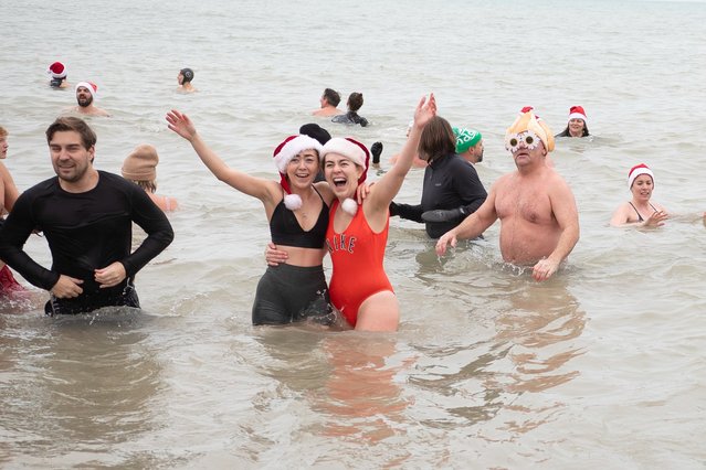 People take part in the annual Brighton Christmas Day Dip on December 25, 2024 in Brighton, England. The Brighton Christmas Day dip is widely accepted as the oldest established Christmas sea swim. People have been turning up on Brighton's beach on Christmas Day to enter the waters since 1860. The event is not organised by any particular group but still manages to bring in hundreds of spectators and participants every year. (Photo by Charlotte Coney/Getty Images)