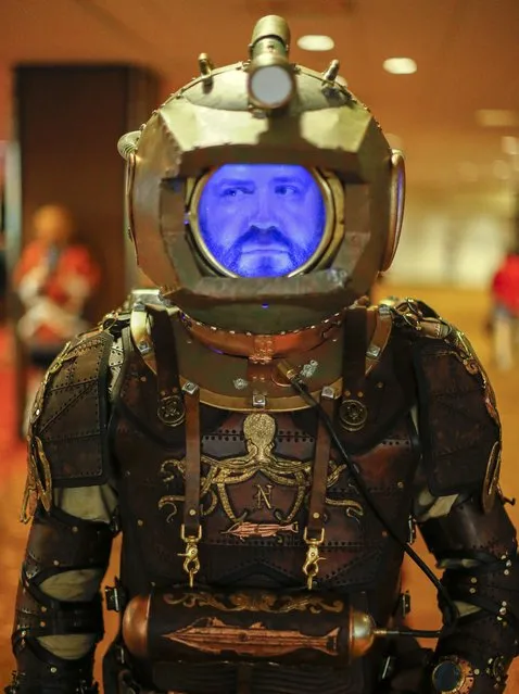 Foster dressed as Captain Nemo  poses for pictures while attending the Dragon Con science fiction and fantasy convention in Atlanta, Georgia, August 29, 2014. Thousands of attendees will crowd downtown during the 28th annual gathering in downtown Atlanta. (Photo by Erik S. Lesser/EPA)