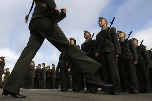 A first year cadet of the Military University of Communication marches during an oath-taking ceremony in St.Petersburg September 6, 2014. (Photo by Alexander Demianchuk/Reuters)