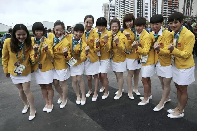 The Chinese team pose as they arrive at the Olympic Village in Rio de Janeiro, Brazil on August 3, 2016. (Photo by Alkis Konstantinidis/Reuters)