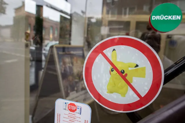 A sticker with Pokemon Go ban is seen in Dusseldorf, Germany in a branch of Volksbank Neuss on August 4, 2016. The Bank has banned the game in its 23 branches, because it is worried about privacy and confidentiality. (Photo by Maja Hitij/DPA)