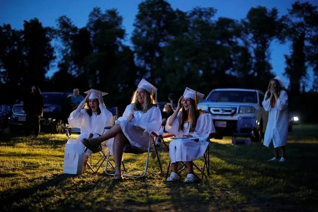 Seniors watch a video retrospective of their time in high school during Pioneer Valley Regional School’s graduation, which was held in the Northfield Drive-In Theater because of the coronavirus disease (COVID-19) outbreak, in Hinsdale, New Hampshire, U.S., June 8, 2020. (Photo by Brian Snyder/Reuters)