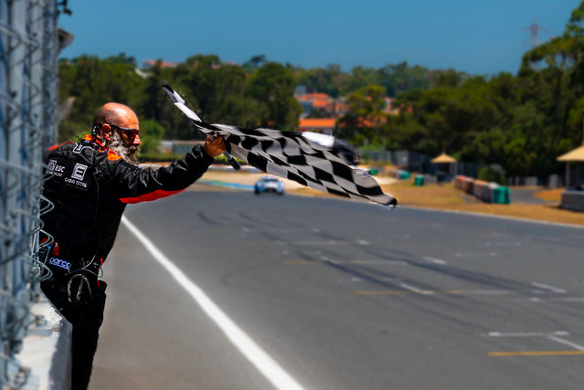 A track marshal waving the checkered flag during the European Endurance qualification of the 11h D Estoril Lamera Cup, on June 7th, 2025 in Lisbon, Portugal. (Photo by Nuno Reisinho/ZUMA Press Wire/Rex Features/Shutterstock)