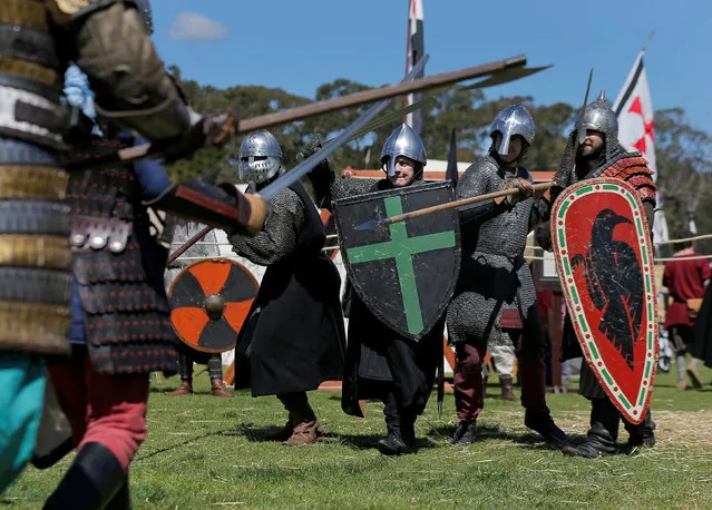 Participants dressed as medieval infantry fight a mock battle at the St Ives Medieval Fair in Sydney, one of the largest of its kind in Australia, September 24, 2016. (Photo by Jason Reed/Reuters)