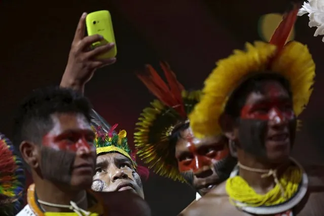 Indigenous people of several tribes watch a presentation by Indigenous people from Kuikuro before the I World Games for Indigenous People in Palmas, Brazil, October 21, 2015. (Photo by Ueslei Marcelino/Reuters)