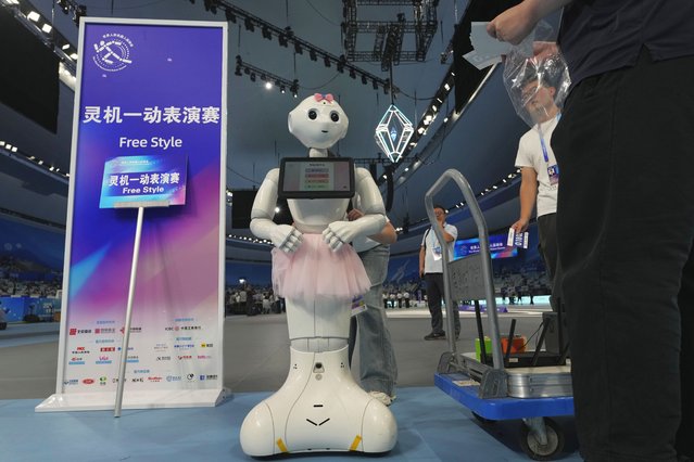 A robot prepares to compete in the Free Style event at the World Humanoid Robot Games held in Beijing, China, Friday, August 15, 2025. (Photo by Ng Han Guan/AP Photo)