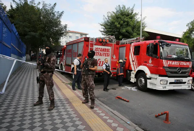 Members of police special forces stand next to a fire truck near the blast site in Istanbul, Turkey, October 6, 2016. (Photo by Huseyin Aldemir/Reuters)