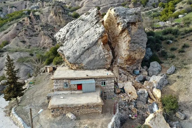 A piece of rock in Adiyaman's Eski Kahta Village first drifted, then split in two and fell on the house. on March 1, 2023 in Adıyaman, Türkiye. The death toll from a catastrophic earthquake that hit Turkey and Syria has topped 45,000, with search and rescue teams starting to wind down their work. (Photo by Halil Kahraman/dia images via Getty Images)
