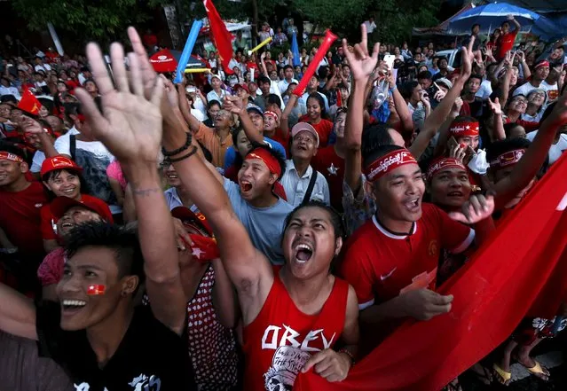 Supporters of Myanmar's pro-democracy figurehead Aung San Suu Kyi gather outside National League for Democracy headquarters (NLD) in Yangon, Myanmar, November 9, 2015. Myanmar's ruling party conceded defeat in the country's general election on Monday, as the opposition led by democracy figurehead Aung San Suu Kyi appeared on course for a landslide victory that would ensure it can form the next government. (Photo by Jorge Silva/Reuters)