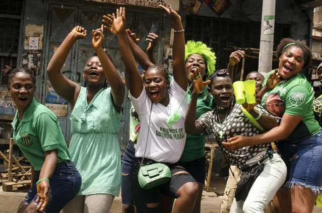Supporters of opposition presidential candidate Julius Maada Bio celebrate his election victory in Freetown, Sierra Leone, Thursday, April 5, 2018. Sierra Leone's former ruling party intends to challenge the results of the presidential runoff vote in court, the losing candidate announced after the opposition party won for the first time in a decade. (Photo by Cooper Inveen/AP Photo)