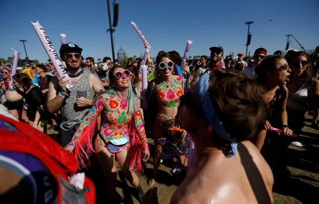 Concertgoers watch a performance by Nile Rodgers at the Coachella Valley Music and Arts Festival in Indio, California, U.S., April 14, 2018. Picture taken April 14, 2018. (Photo by Mario Anzuoni/Reuters)