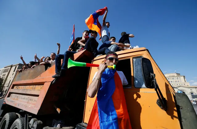 Armenian opposition supporters ride on a truck at Republic Square after protest movement leader Nikol Pashinyan announced a nationwide campaign of civil disobedience in Yerevan, Armenia May 2, 2018. (Photo by Gleb Garanich/Reuters)