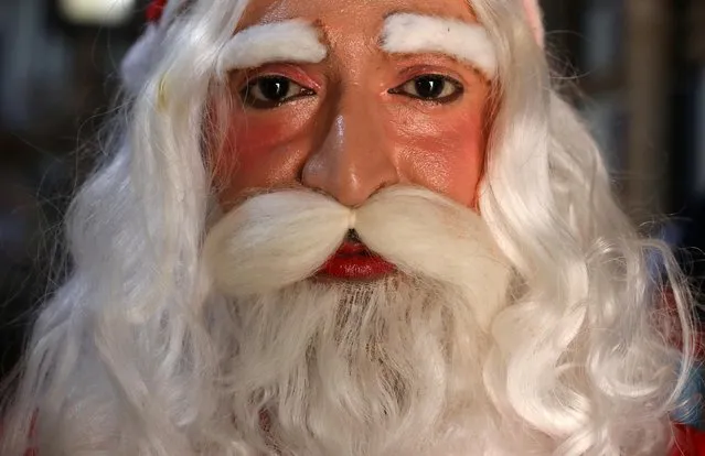 Kamal Krishna Bairagi, 41, poses for photograph dressed as Santa Claus at his home in Kolkata, India, December 4, 2020. “I wish to make the world war-free, pollution-free and epidemic-free for our coming generations. No one should cheat each other, God is watching everything from above. I wish and pray to God to save the world from COVID-19 and my sincere wish to say bye-bye to the disease by the end of 2020”, said Bairagi. “Politicians are on my naughty list and actors, like me, who entertain people no matter what the situation is, are on my nice list”. (Photo by Rupak De Chowdhuri/Reuters)