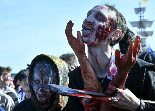 People wearing costumes participate in the annual “Zombie Walk” in Bordeaux on October 22, 2016. (Photo by Georges Gobet/AFP Photo)