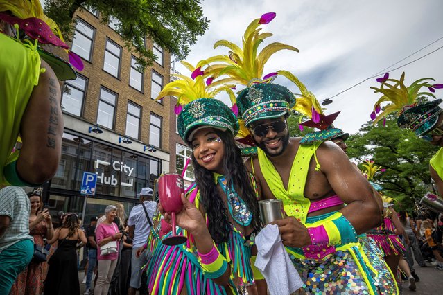 Revellers get into the spirit of the 40th annual Zomercarnaval – summer carnival –  in Rotterdam on July 28, 2024. The two-day event is such in integral part of Netherlands tradition it was added to Unesco’s Intangible Cultural Heritage list last year. (Phoot by James Petermeier/ZUMA Press Wire)