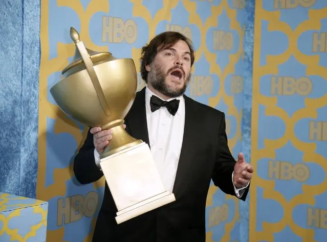 Actor Jack Black poses with a trophy that was a part of the decor at the HBO after party after the 72nd annual Golden Globe Awards in Beverly Hills, California January 11, 2015. (Photo by Danny Moloshok/Reuters)