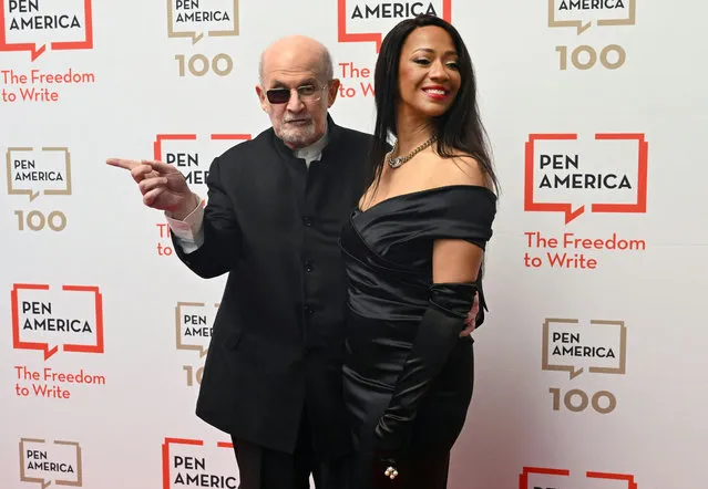 British-US author Salman Rushdie and his wife Rachel Eliza Griffiths arrive for the PEN America Literary Gala at the American Museum of Natural History in New York City on May 18, 2023. This year's gala, hosted by US comedian Colin Jost, is honoring Canadian writer and producer Lorne Michaels. (Photo by Timothy A. Clary/AFP Photo)