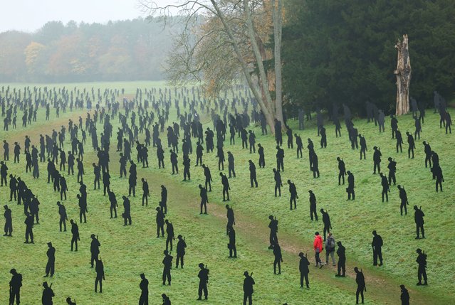 People view “For Your Tomorrow”, an art installation of 1,475 silhouettes of World War II military personnel as a memorial to the soldiers killed in the 1944 D-Day landings 80 years ago, ahead of this year's Remembrance commemorations, at Stowe Gardens, in Stowe, Britain on November 7, 2024. (Photo by Toby Melville/Reuters)