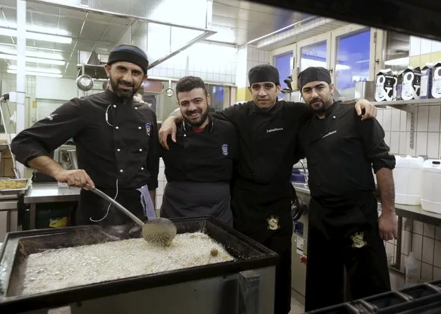 Chief assistants, refugees Wela al-Sumari (L to R), Ali Husein, Mogdad Ajad and Wacl al-Shater, pose for a picture in kitchen in their camp at a hotel touted as the world's most northerly ski resort in Riksgransen, Sweden, December 15, 2015. (Photo by Ints Kalnins/Reuters)