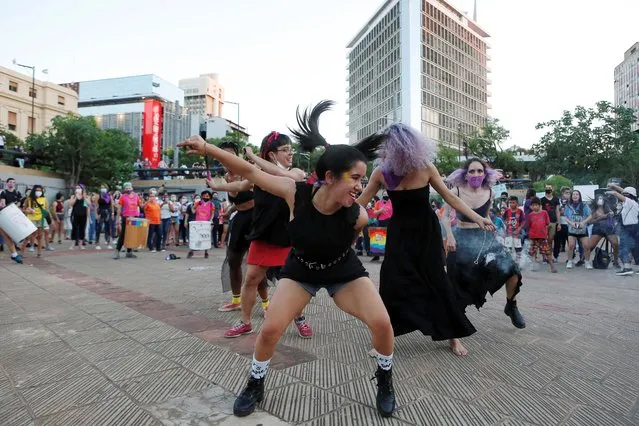 Activists perform as they take part in a demonstration to mark International Women's Day in Asuncion, Paraguay on March 8, 2021. (Photo by Cesar Olmedo/Reuters)