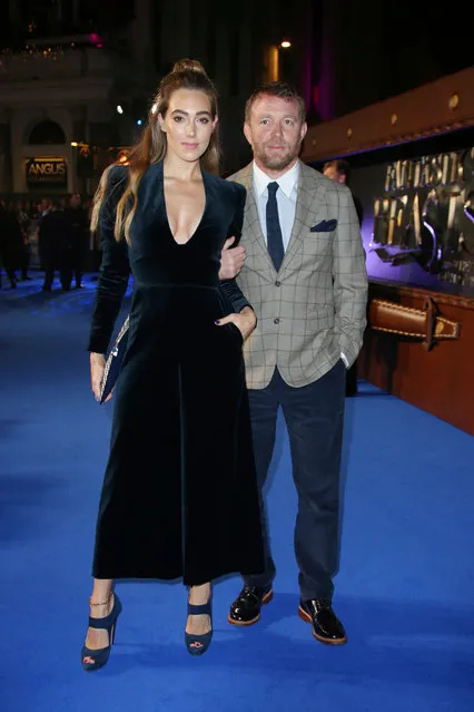 Director Guy Ritchie, right, and his wife Jacqui Ainsley pose for photographers upon arrival at the premiere of the film “Fantastic Beasts And Where To Find Them” in London, Tuesday, November 15, 2016. (Photo by Joel Ryan/Invision/AP Photo)