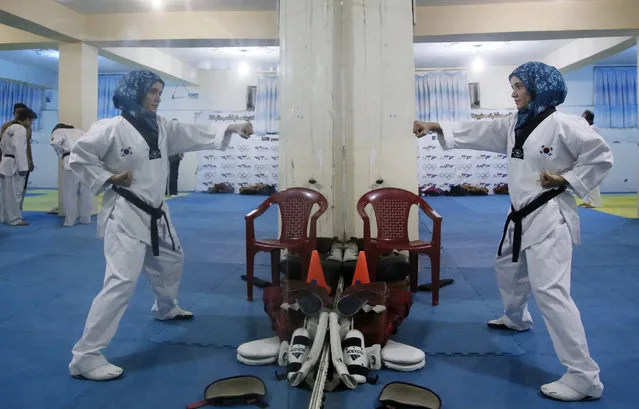 An Afghan girl practice Taekwando, at a Gym in Kabul, Afghanistan, 22 November 2016. For nearly two decades during the Taliban rule in Afghanistan, sports and games including boxing, soccer, volleyball, kite flying, and chess had been banned as immoral and unlawful. During the Taliban regime it was forbidden for women to participate in such sports and games. The Taliban's Islamist regime was toppled by a US-led campaign in late 2001. (Photo by Jawad Jalali/EPA)